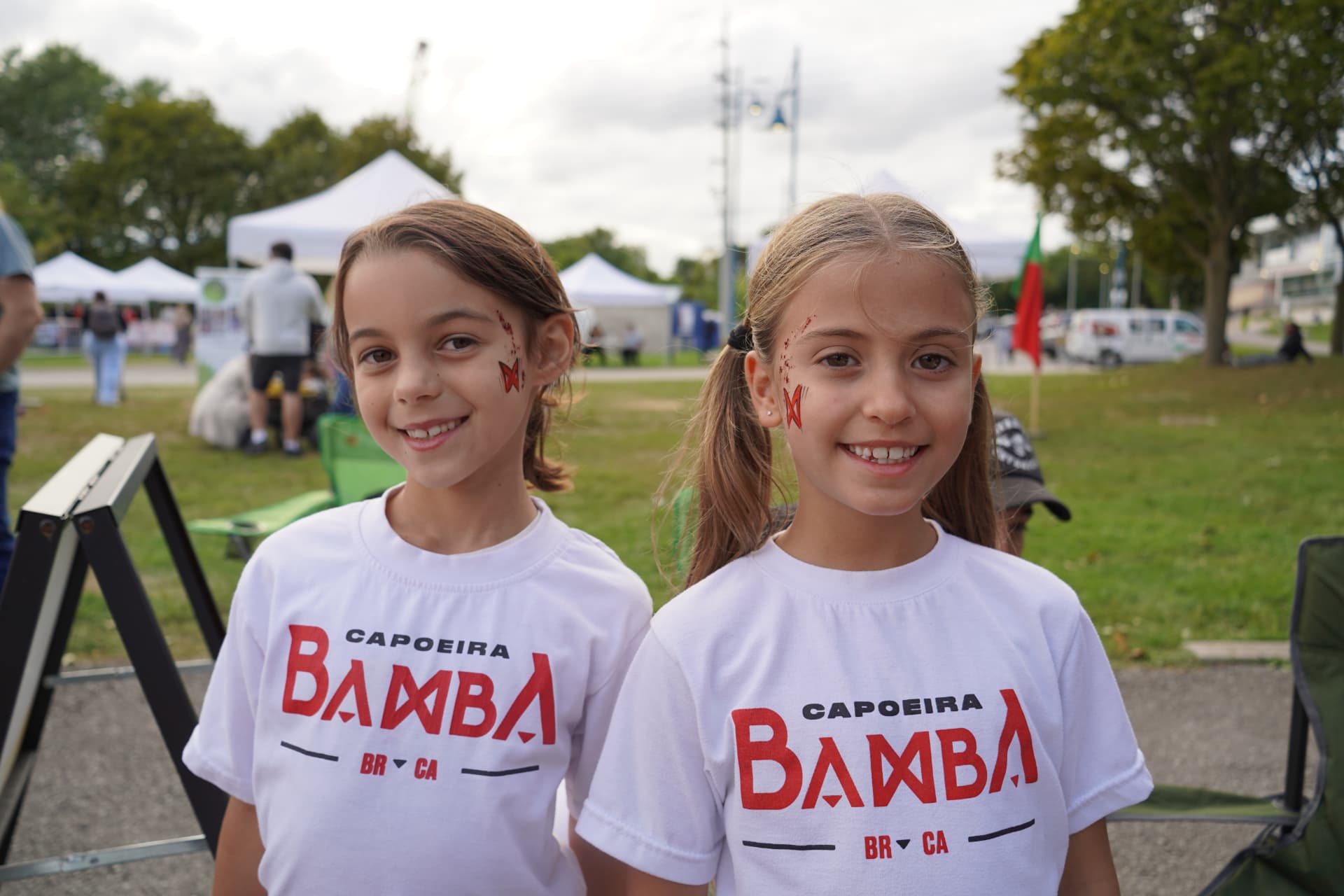 Two young Capoeira Bamba students at an outdoor community event