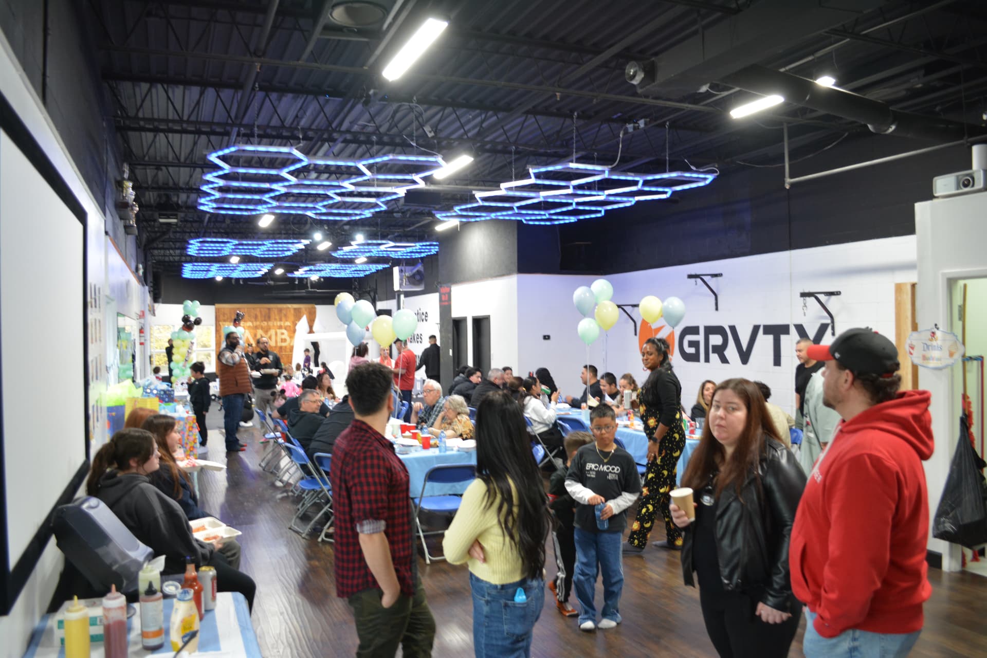 Children and adults enjoying a private birthday celebration at Z GRVTY