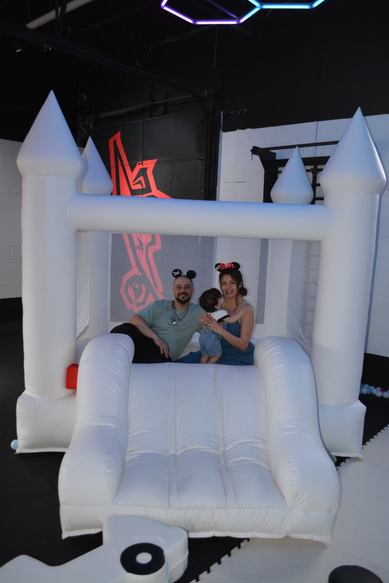 A family enjoying the inflatable play area during a children's party at Z GRVTY