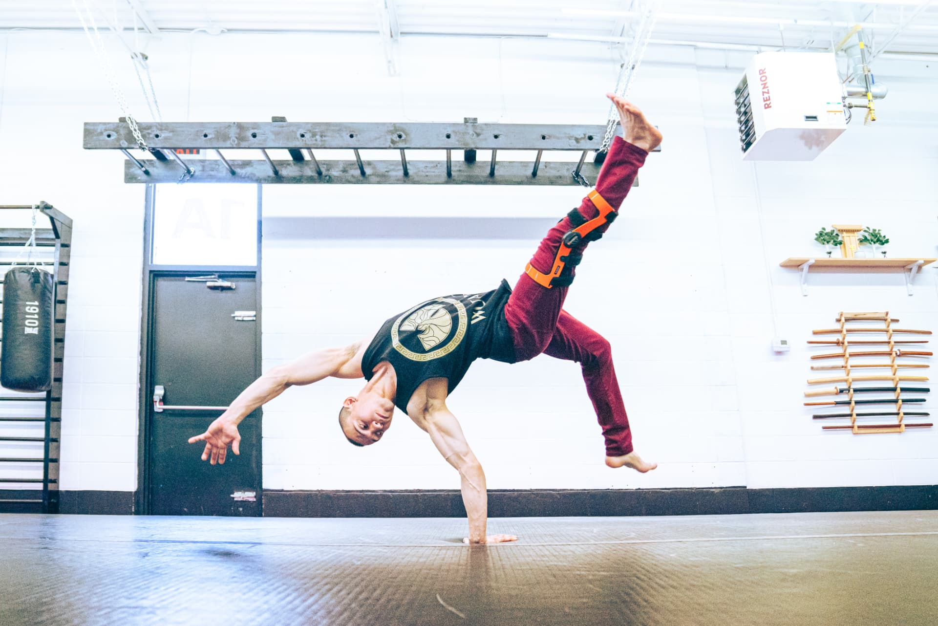 An athlete practising an acrobatic movement during Open Floor training