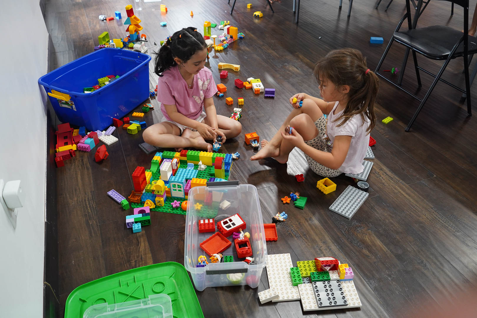 Children playing together on the hardwood floor at Z GRVTY