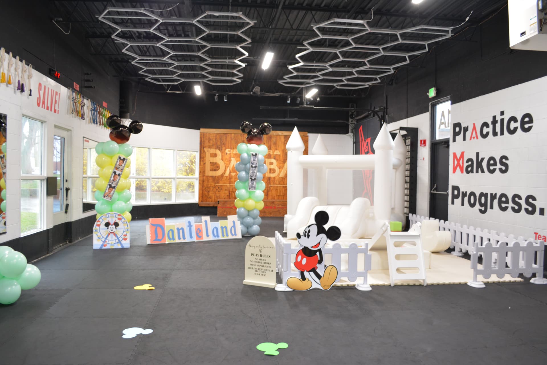 A children's birthday party with an inflatable play area and balloon decorations at Z GRVTY